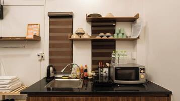 Fridge, microwave, cookware/dishes/utensils, spices