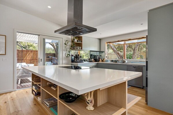 Fridge, dishwasher, coffee/tea maker, cookware/dishes/utensils