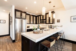 Fridge, microwave, oven, stovetop - Modern Mountain Townhome in Canyons Village – Hot Tub, Ski Lifts & Activities Just Steps Away (Park City)