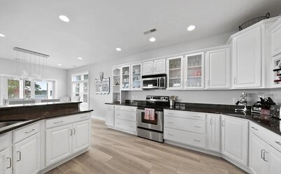 Waterfront retreat just minutes to the beach. Sleeps 14.