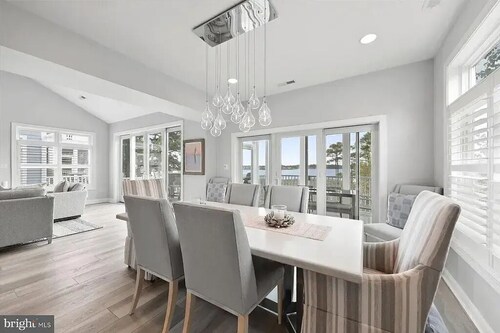 Waterfront retreat just minutes to the beach. Sleeps 14.