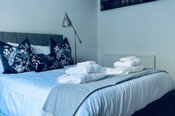 Double bed with fresh linen, wardrobes & drawers.