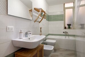 Hair dryer, bidet, towels, toilet paper