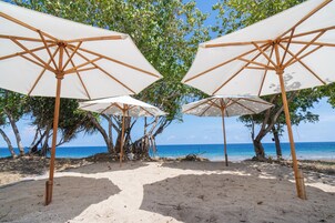 Private beach, white sand, sun loungers, beach umbrellas