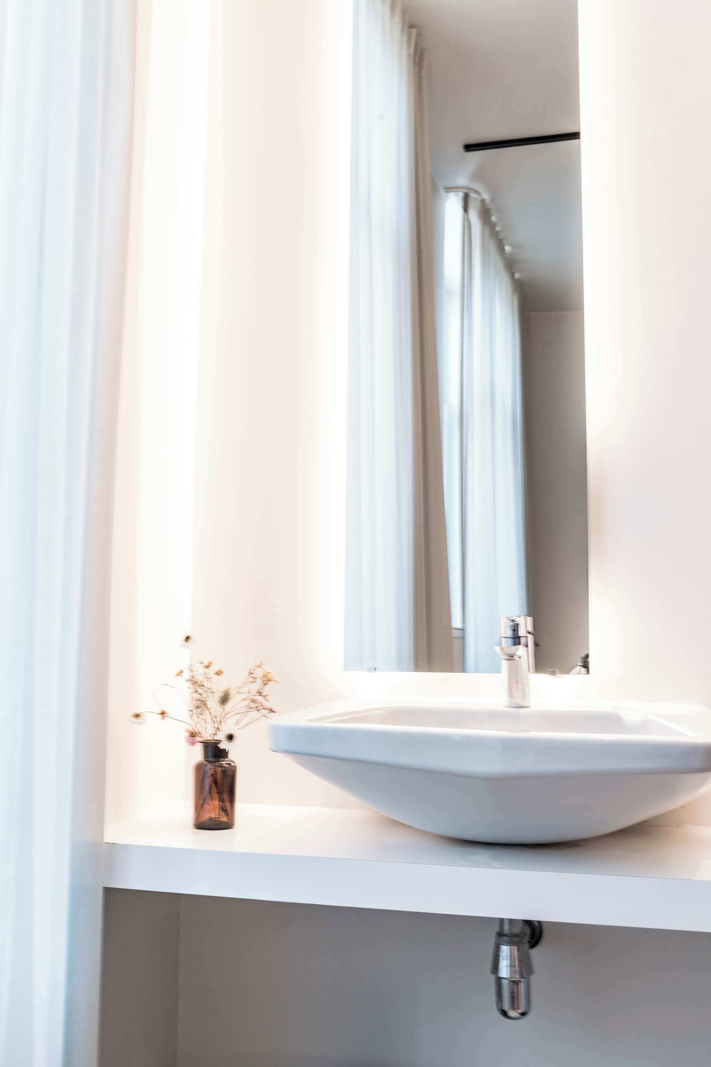 Shower, hair dryer, towels, toilet paper