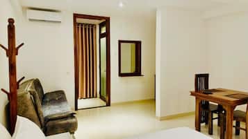 Deluxe Studio Suite, Balcony, Lake View | Living area | 32-inch TV with cable channels
