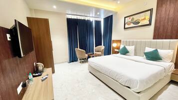 Premium bedding, desk, laptop workspace, soundproofing