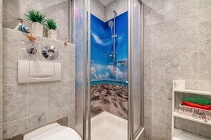 Shower, hair dryer, towels