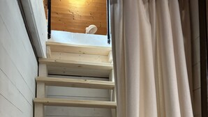 A wooden staircase with a white railing and a white curtain partially covering the view. - Holiday Apartment Herzogenhorn with Mountain View, Private Terrace and Wi-Fi (Bernau im Schwarzwald)