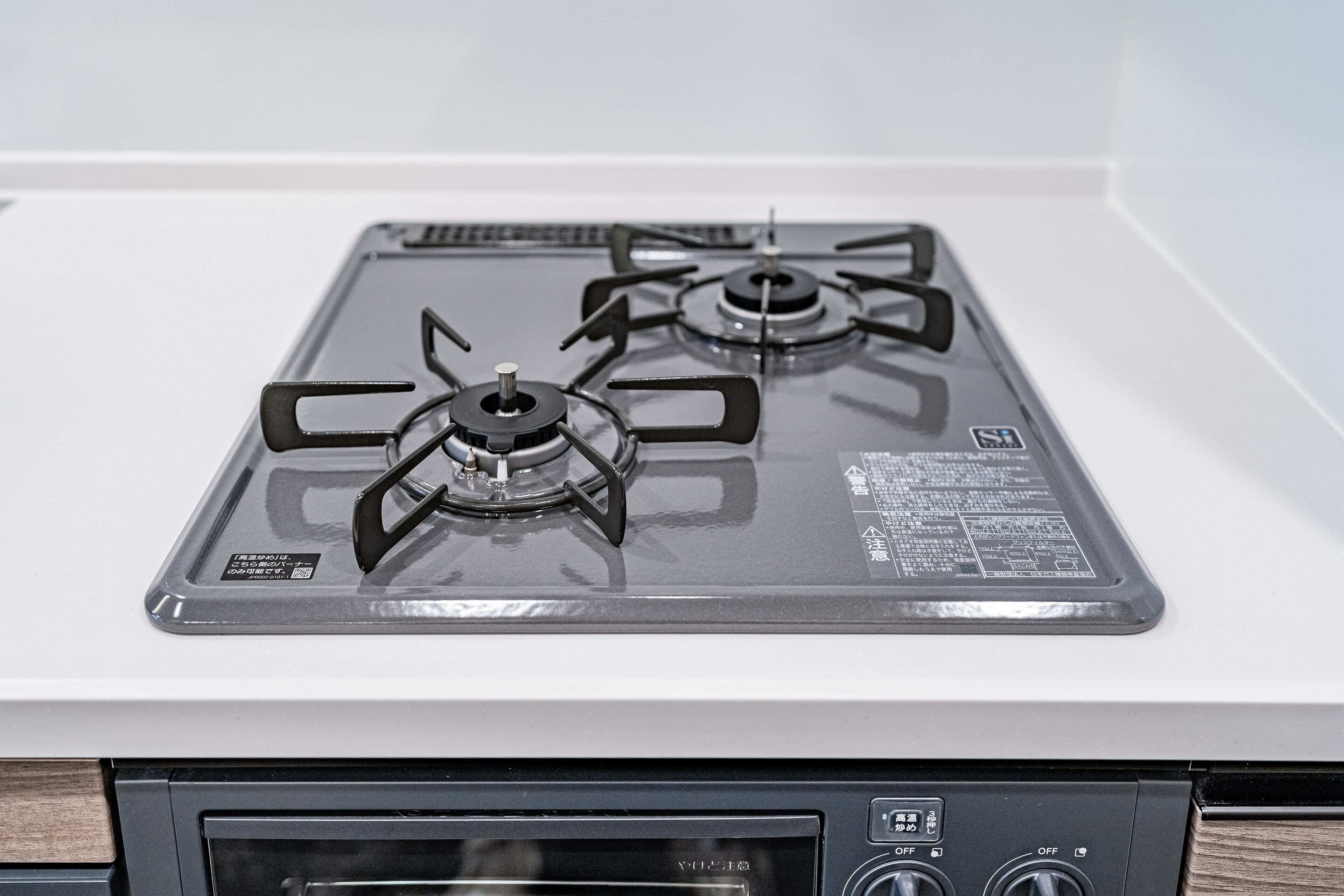 A stove with four burners and a control panel with an 'OFF' switch.