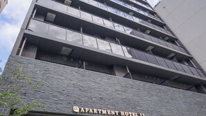 A modern multi-story building with a prominent entrance labeled "Apartment Hotel 11". - Apartment Hotel 11 Namba Minami IV (Osaka)