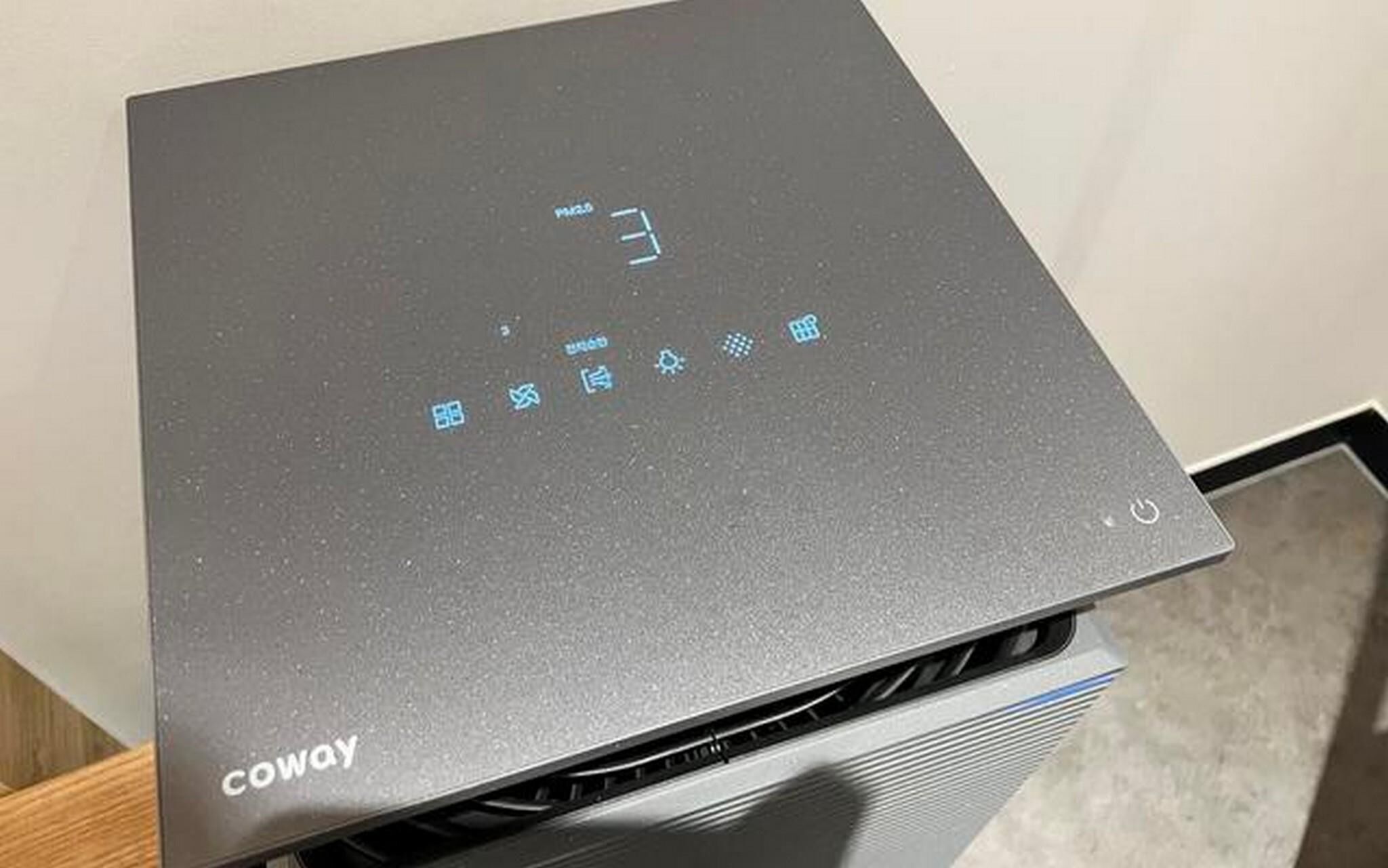 A device with a control panel featuring icons and the word 'COWAY' on the side.