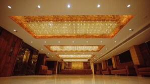 A spacious lobby with a reflective floor, multiple seating areas, and a large decorative ceiling. - Hotel Guru Kripa, Bhopal (Bhopal)