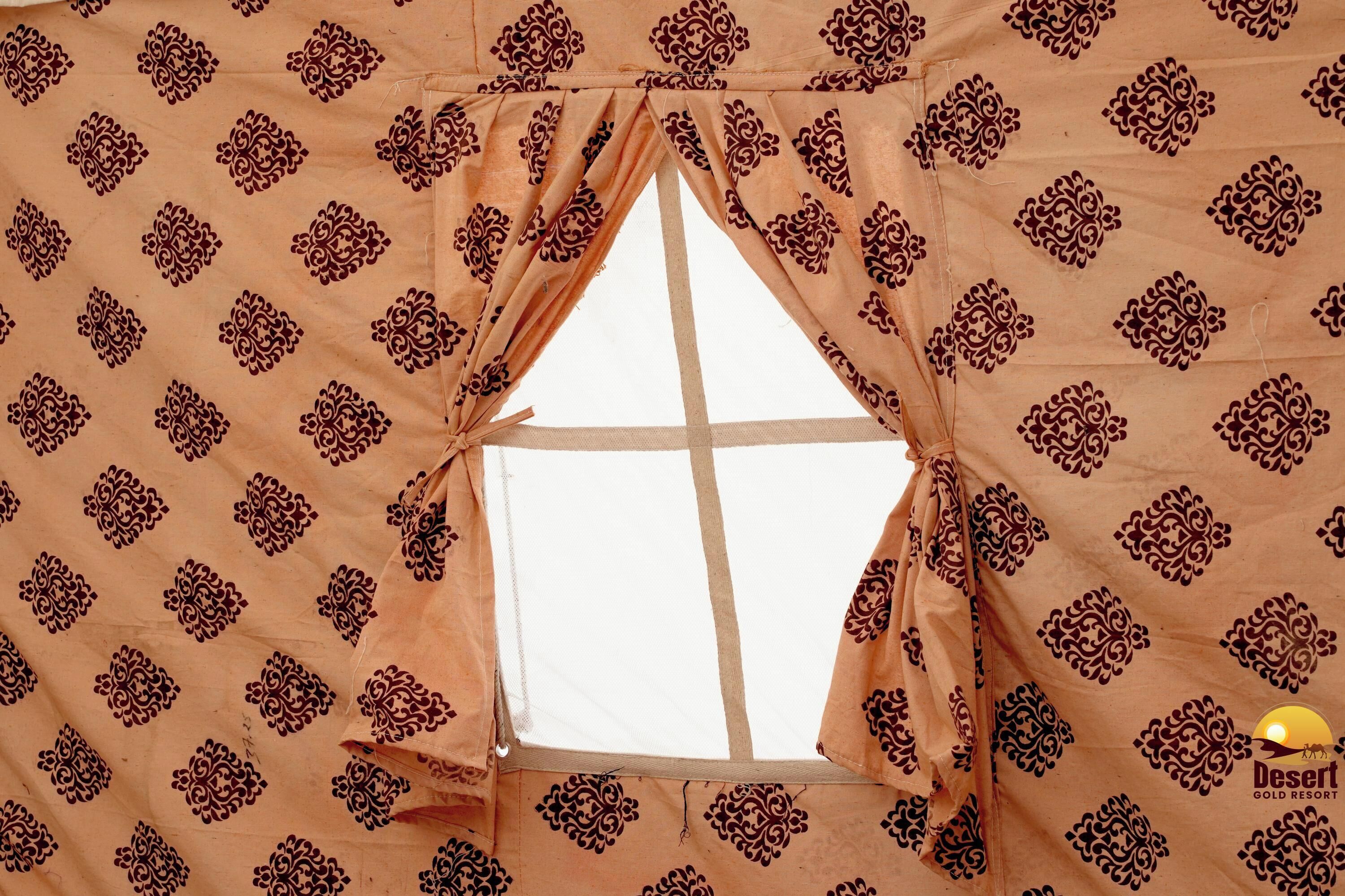 A window with a geometric pattern and a view of the sky.