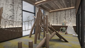Zona de juegos con estructuras de madera y un ventanal grande.