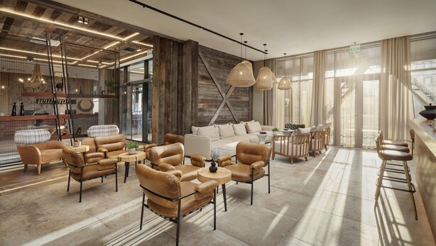 A spacious lobby with leather sofas, a coffee table, and pendant lighting. - Wulfenia Hotel & Spa (Kolašin)
