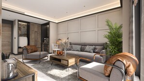 A modern living room with a grey sofa, leather armchairs, a wooden coffee table, and a large plant. - Wulfenia Hotel & Spa (Kolašin)