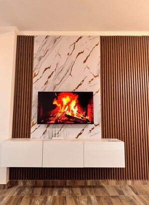 Deluxe Apartment, 2 Bedrooms, Balcony | Living area | 40-inch Smart TV with satellite channels