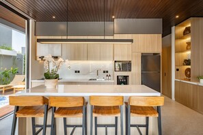 Fridge, microwave, stovetop, coffee/tea maker