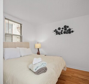 1 bedroom, desk, iron/ironing board, travel crib
