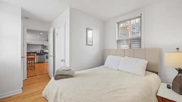 1 bedroom, desk, iron/ironing board, travel crib