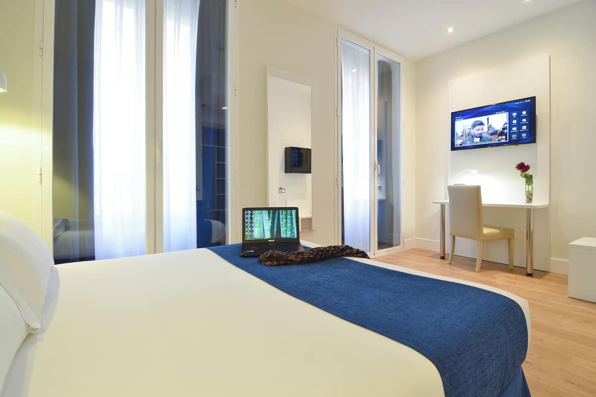 Premium bedding, down comforters, free minibar, in-room safe