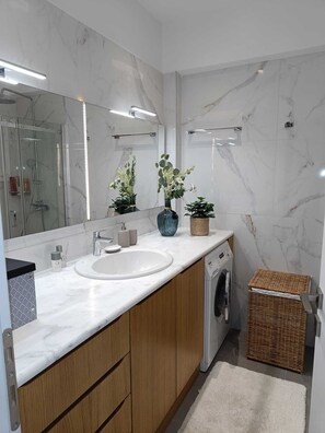 Shower, hair dryer, towels, soap