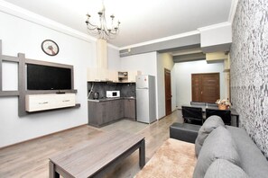 Deluxe Apartment, City View | Private kitchen | Full-size fridge, microwave, stovetop, cookware/dishes/utensils - Apartment in Teryan street (Yerevan)