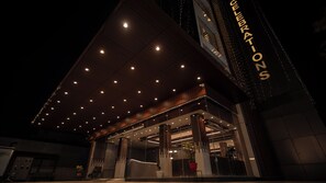 A modern building with a prominent 'COLLABORATION' sign, large windows, and a covered entrance area. - Hotel J.K. Celebration (Jabalpur)