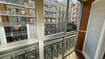 Quadruple Room, 2 Double Beds, Shared Bathroom, City View | Balcony