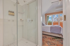 Shower, hair dryer, towels, shampoo