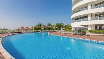 Outdoor pool, pool umbrellas, pool loungers