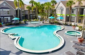 Outdoor pool, a heated pool - Cozy 1-Bedroom Apartment with Pool, Just 10 Minutes from Disney Magic! (Kissimmee)