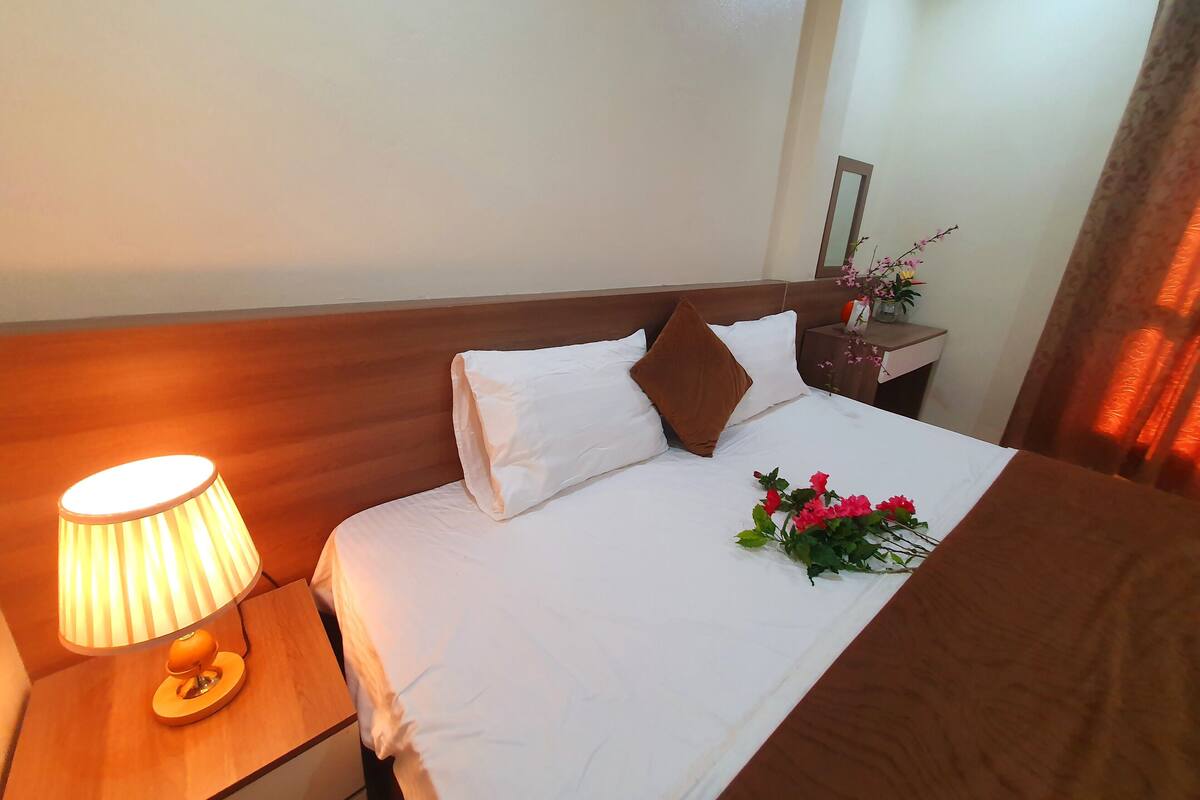 Premium bedding, desk, laptop workspace, free WiFi