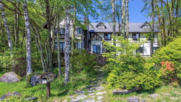 A two-story building with a stone pathway leading to the entrance. - KANALIAN HOTEL (Nagawa)