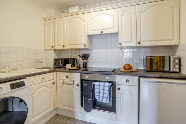Fridge, microwave, oven, cookware/dishes/utensils