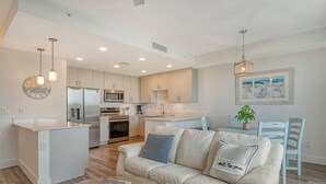 A modern kitchen with a central island, stainless steel appliances, and pendant lighting. - NEW! Waterfront Luxury in Sarasota – Near Downtown & Beaches! (Sarasota)