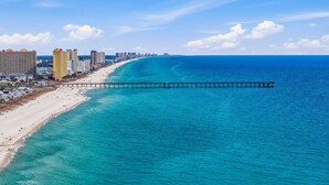A coastal cityscape with a beach, a pier, and high-rise buildings. - *Aug 29 - Sept 2 Open * End of Summer Getaway!* (Panama City Beach)