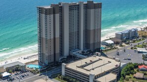 A high-rise hotel with multiple floors, a swimming pool, and a beach view. - *Aug 29 - Sept 2 Open * End of Summer Getaway!* (Panama City Beach)