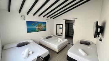 Basic Quadruple Room | Soundproofing, free WiFi, bed sheets