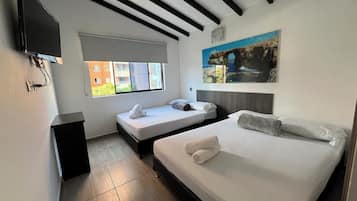 Basic Quadruple Room | Soundproofing, free WiFi, bed sheets