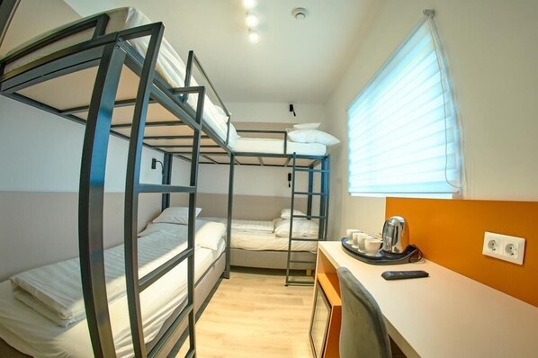 A bunk bed room with a desk and a window. - Ice Premium Apartments  (Veszprem)