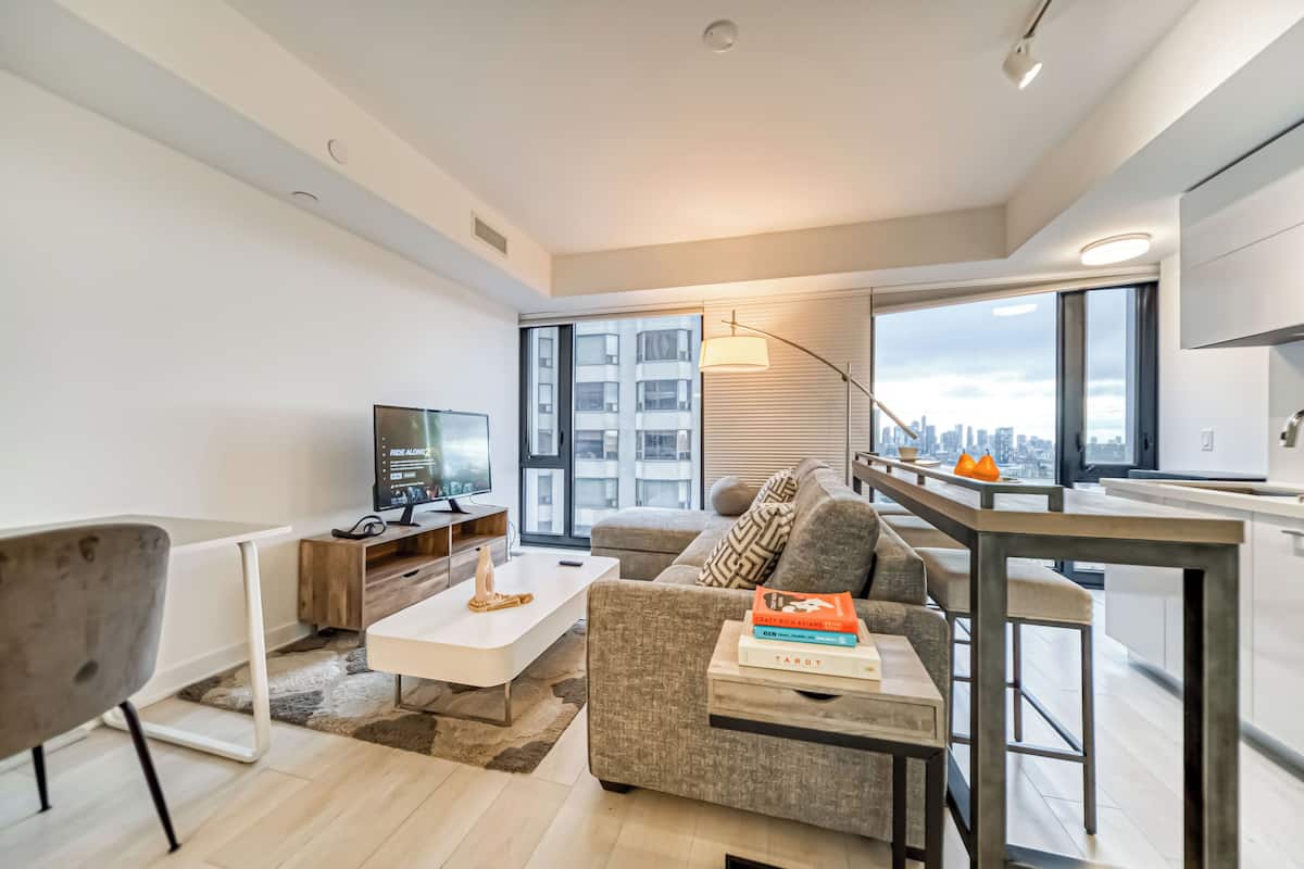 Premium Condo, City View | 1 bedroom, blackout drapes, free WiFi, bed sheets