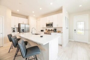 Fridge, microwave, oven, stovetop - Reunion resort vacation rental near Disney (Kissimmee)