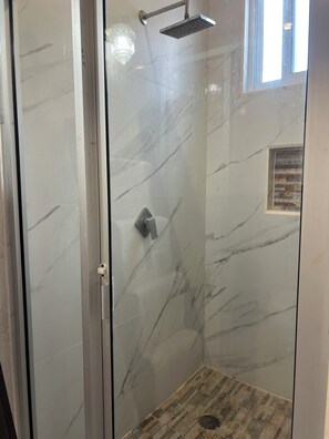 Shower, towels, soap, toilet paper