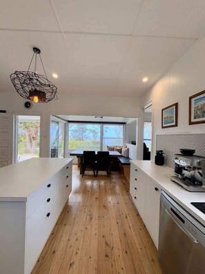 Fridge, stovetop, cookware/dishes/utensils, dining tables