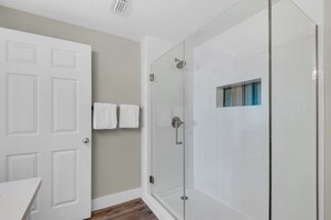 Shower, hair dryer, towels, soap