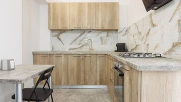 Fridge, microwave, stovetop, coffee/tea maker