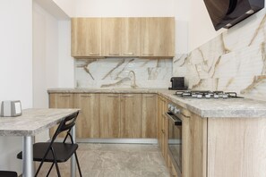 Fridge, microwave, stovetop, coffee/tea maker