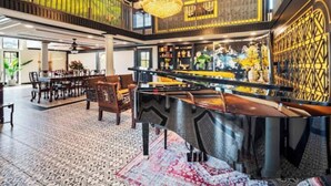 A spacious lobby with a high ceiling, a central bar area, and a patterned floor. - Fruit Trees, Farm Stay, Ranch Retreat, Lake Access (Fallbrook)